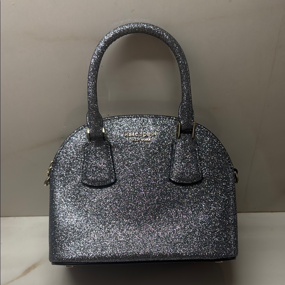 Kate Spade Silver Satchel with Glittery Finish
Brand new never used missing tag